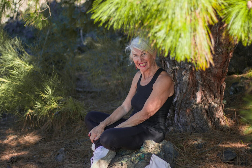 senior woman stretching outdoors
