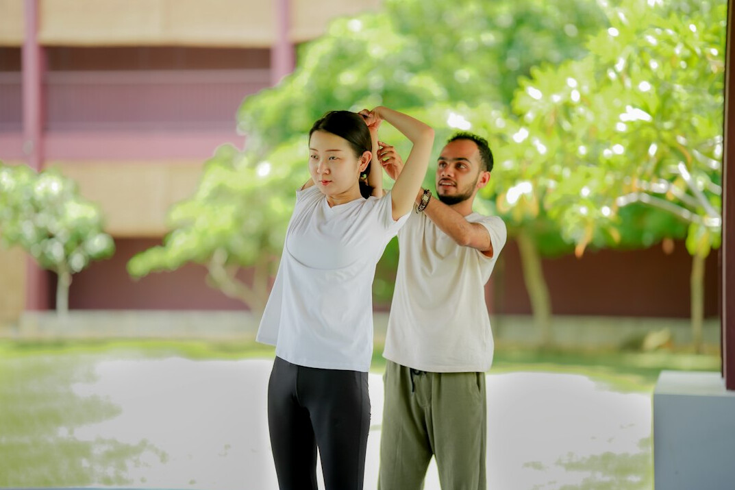 elderly people exercising together
